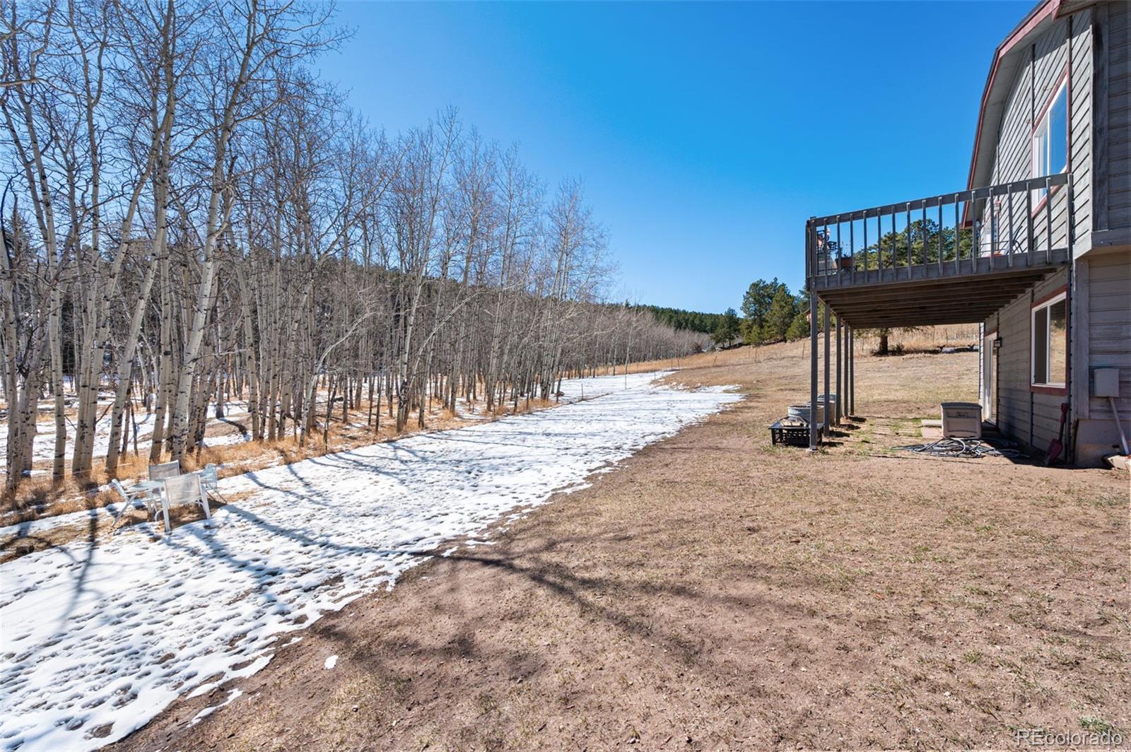 2222 County Road 72 Bailey, CO 80421 - Photo 36 of 50 a view of a backyard with a house