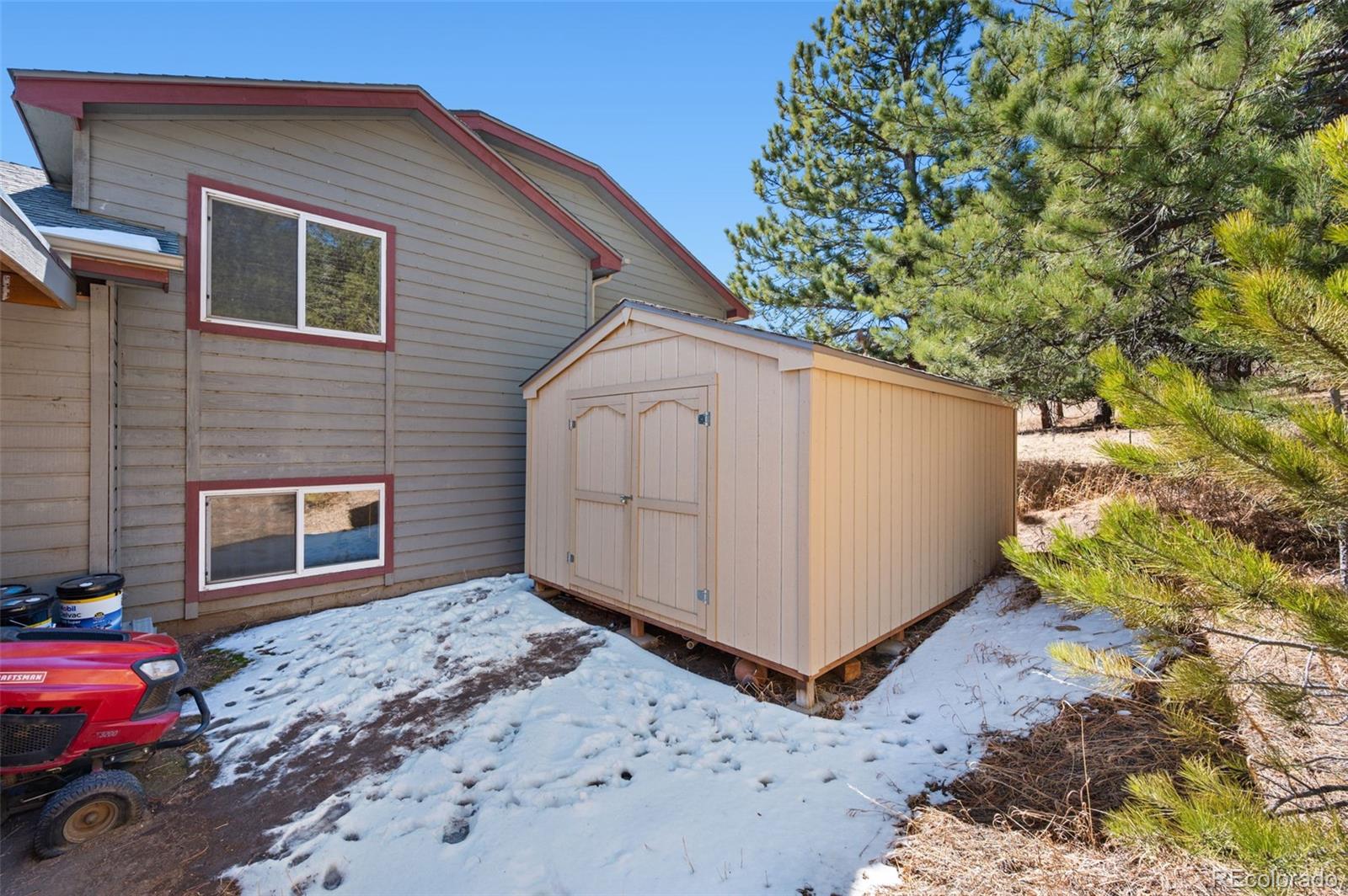 2222 County Road 72 Bailey, CO 80421 - Photo 38 of 50 a view of a house with a backyard