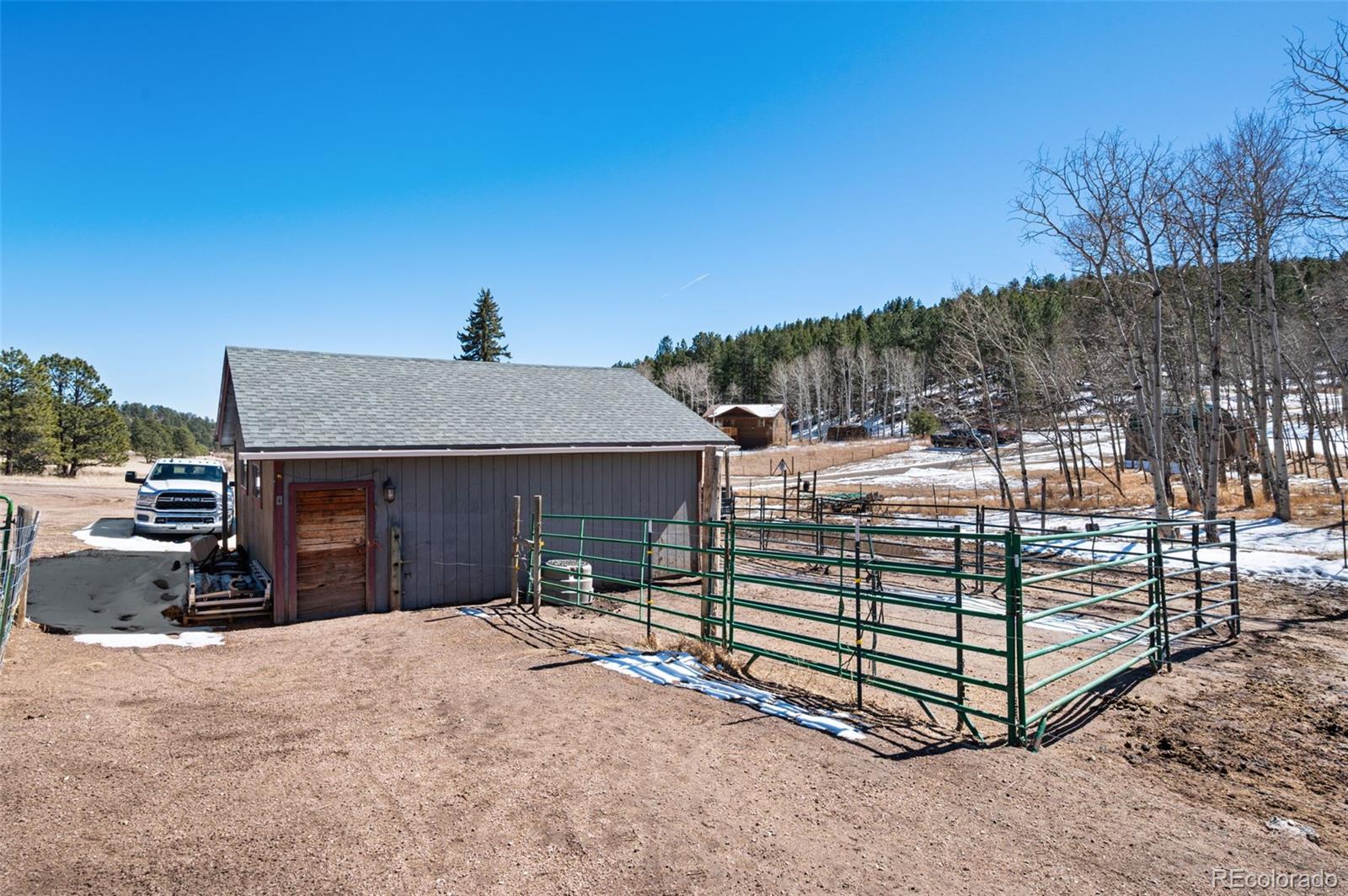 2222 County Road 72 Bailey, CO 80421 - Photo 41 of 50 a view of a house with a yard