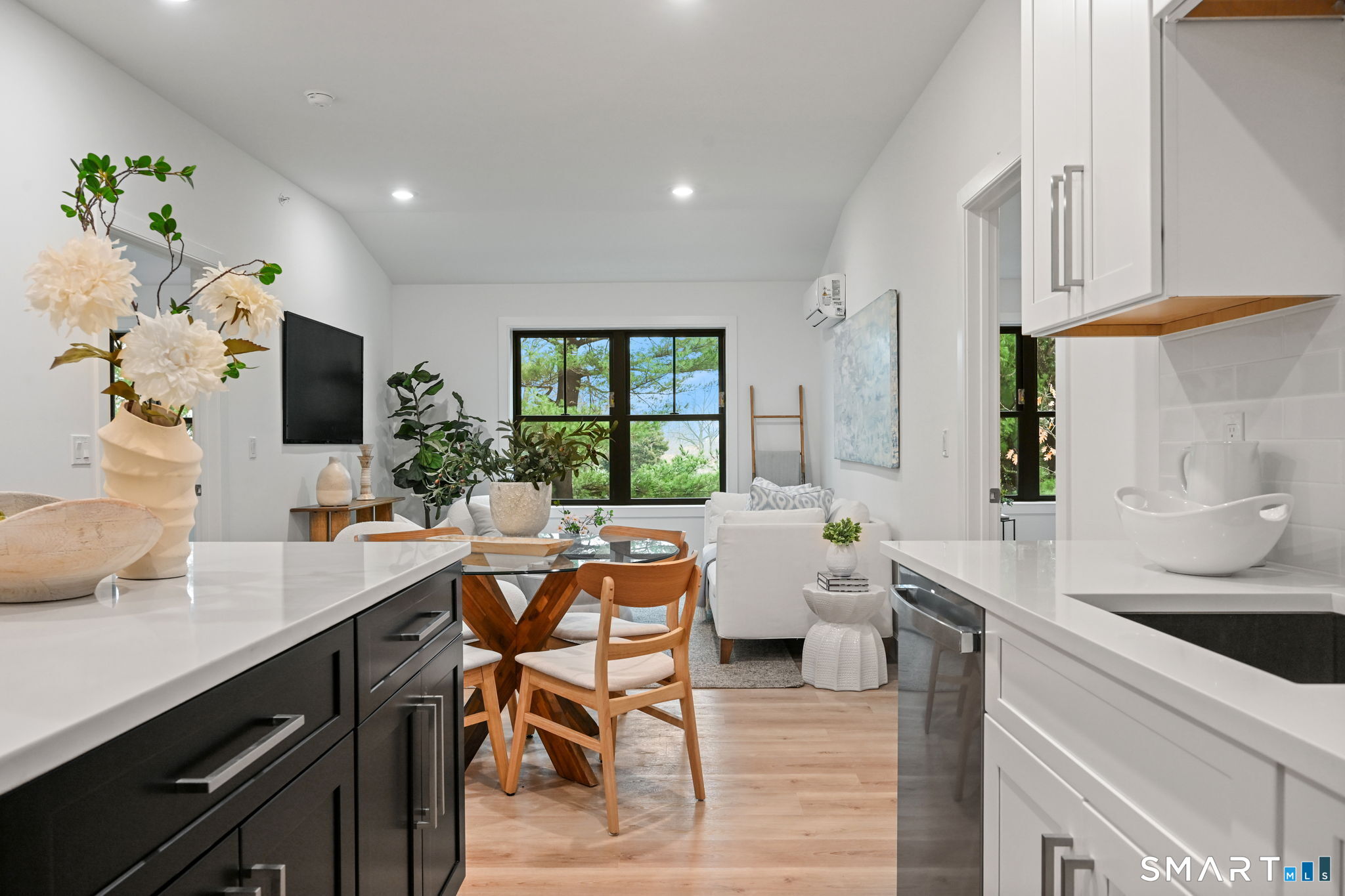 a kitchen with a table chairs stove and cabinets