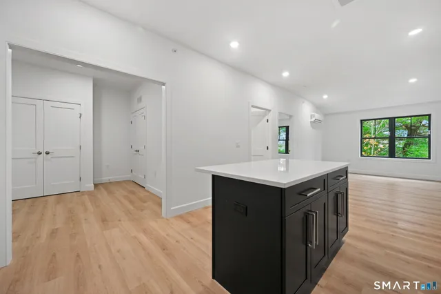 a kitchen with a sink and natural light