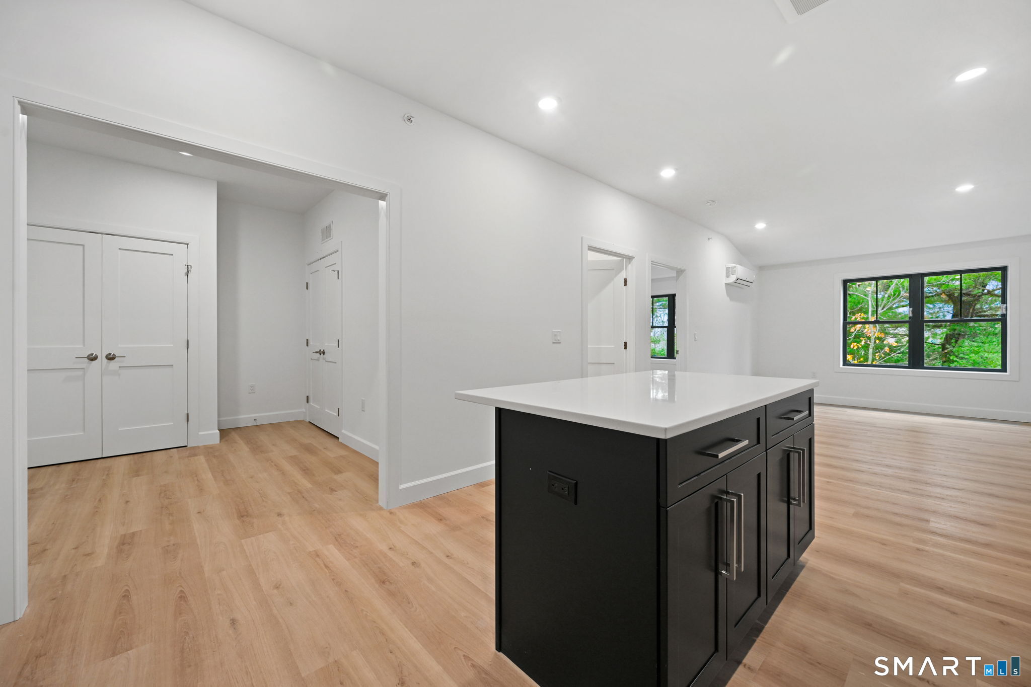 131 Beach Road, Unit 202 Fairfield, CT 06824 - Photo 12 of 32 a kitchen with a sink and natural light