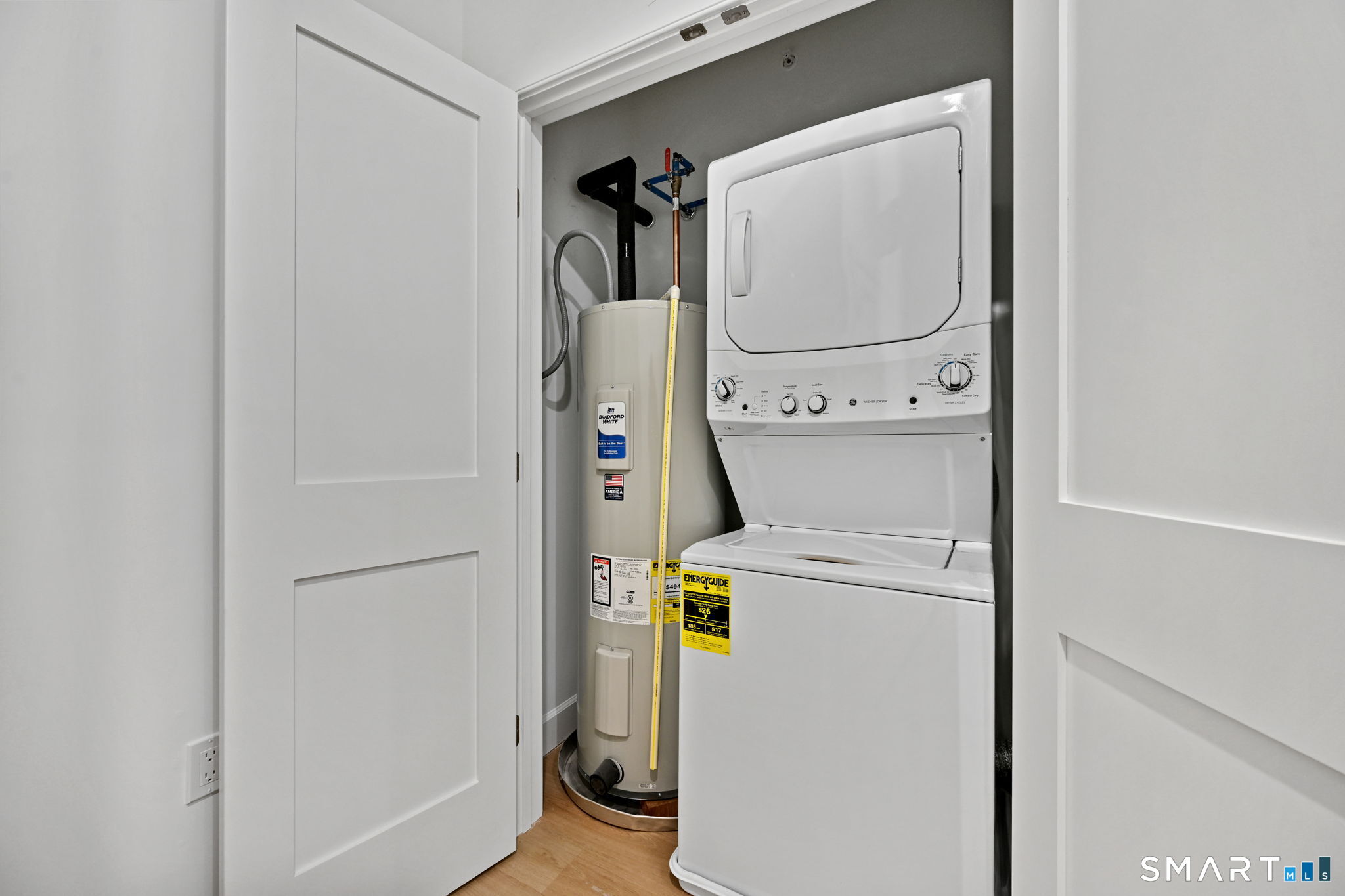 131 Beach Road, Unit 202 Fairfield, CT 06824 - Photo 24 of 32 a utility room with dryer and washer