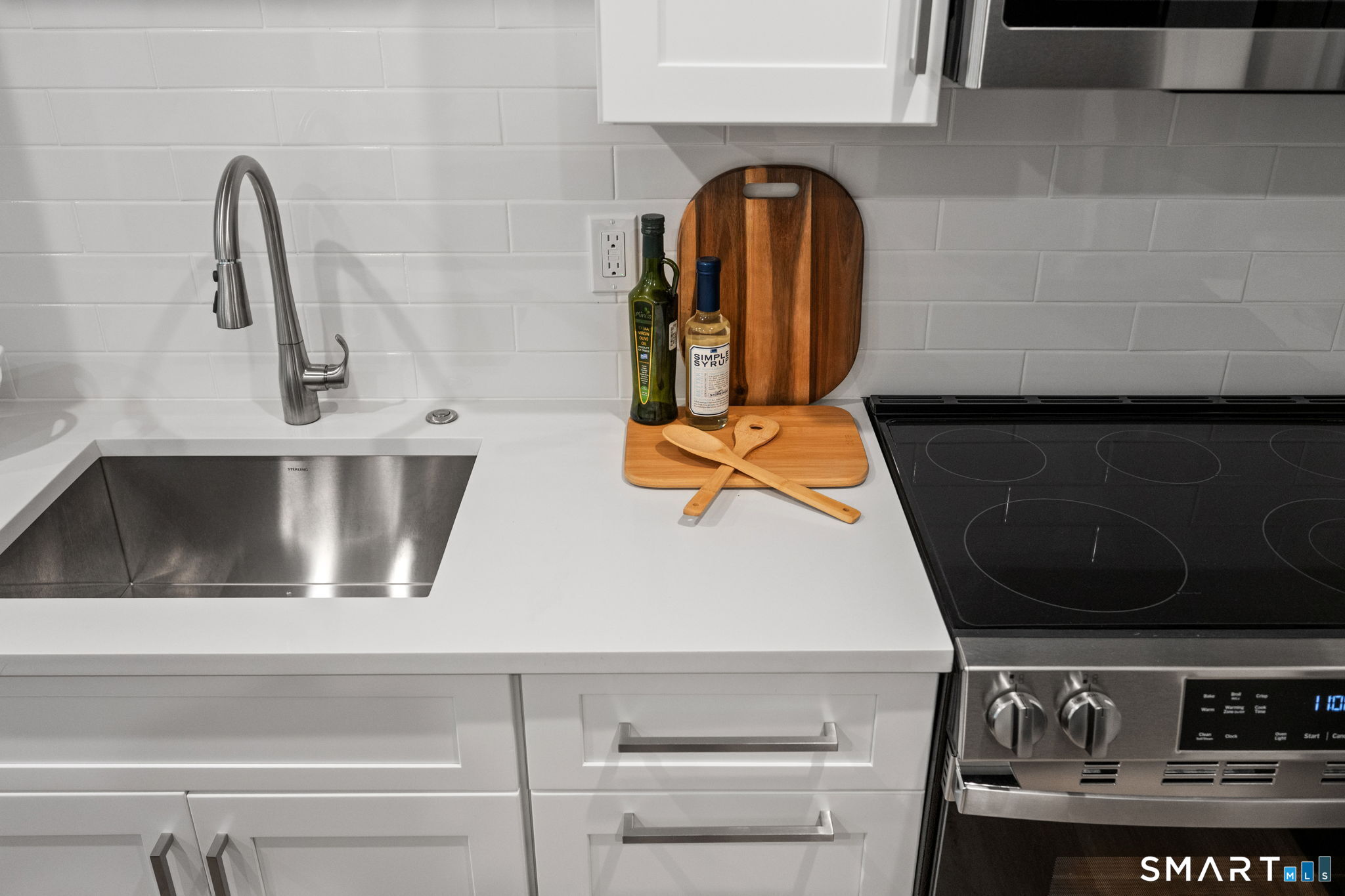 131 Beach Road, Unit 202 Fairfield, CT 06824 - Photo 3 of 32 a close view of sink and tap