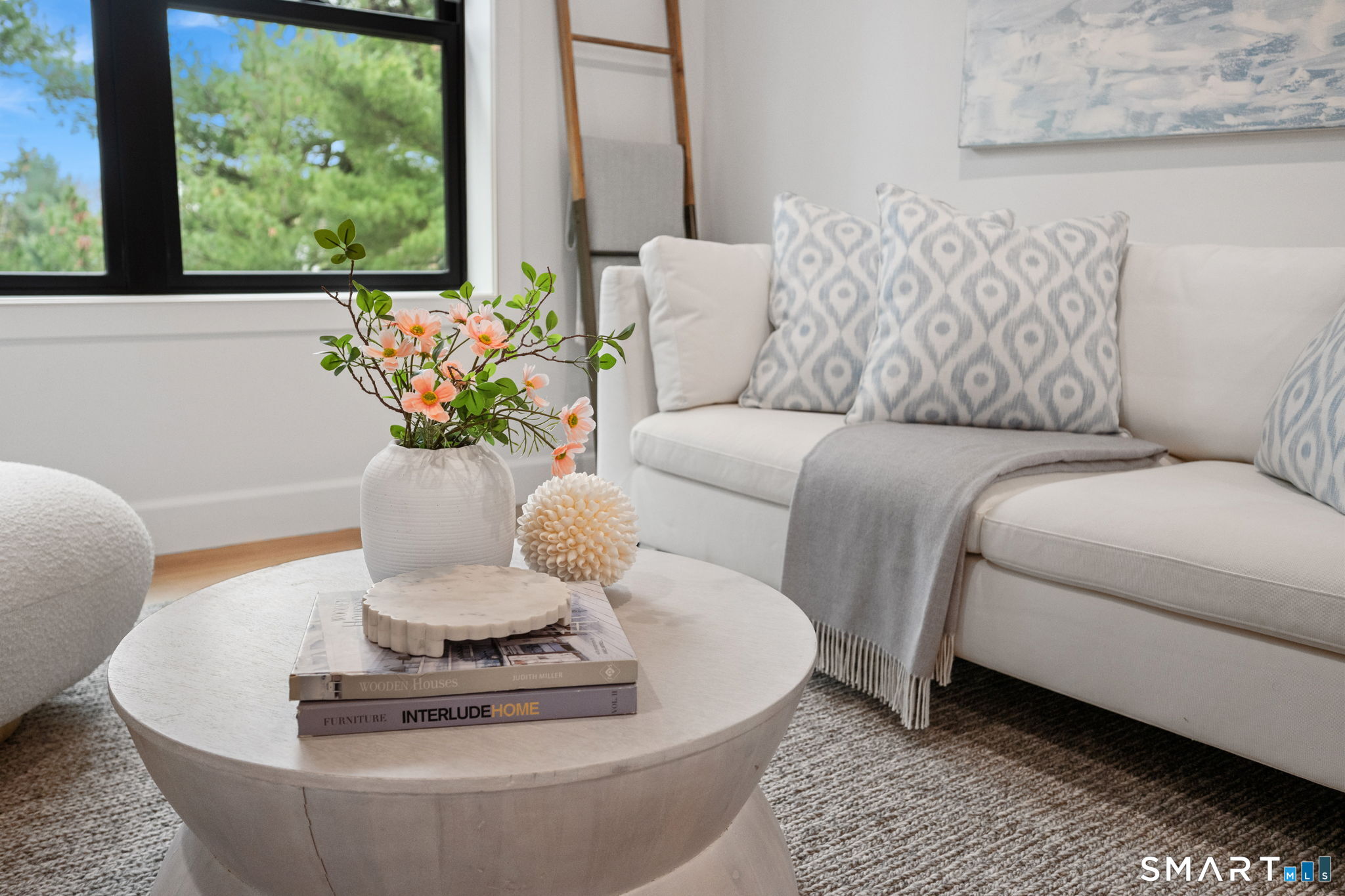 131 Beach Road, Unit 202 Fairfield, CT 06824 - Photo 6 of 32 a living room with furniture and a potted plant