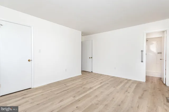 a kitchen with stainless steel appliances a stove a sink and a refrigerator