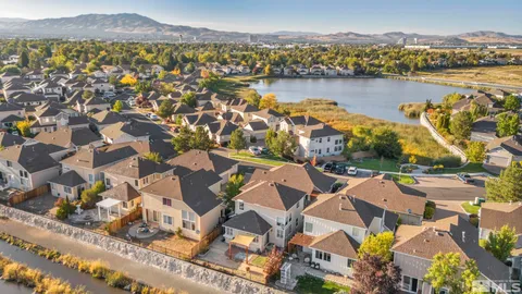 an aerial view of residential building with outdoor space and river