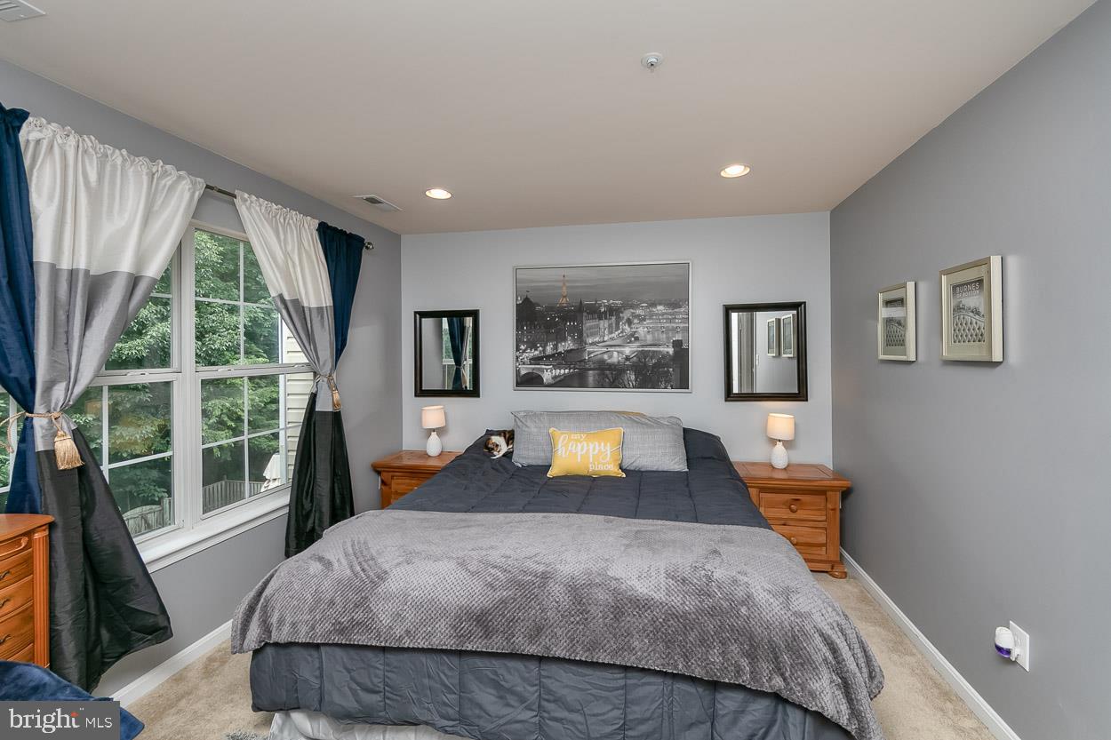 3504 Corn Stream Road Randallstown, MD 21133 - Photo 17 of 34 a bed room with a bed and a large window