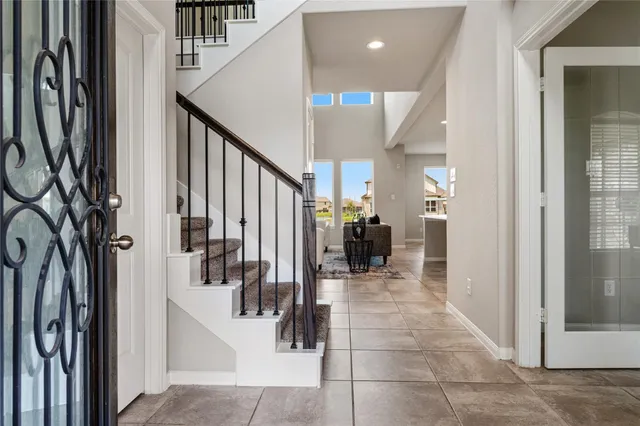 a view of entryway and hall with dining room