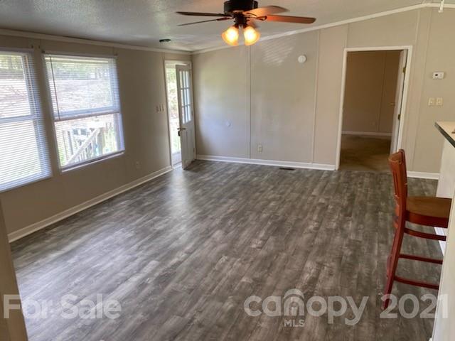 3310 Falcon Ridge Road Maiden, NC 28650 - Photo 3 of 12 a view of an empty room with window and wooden floor