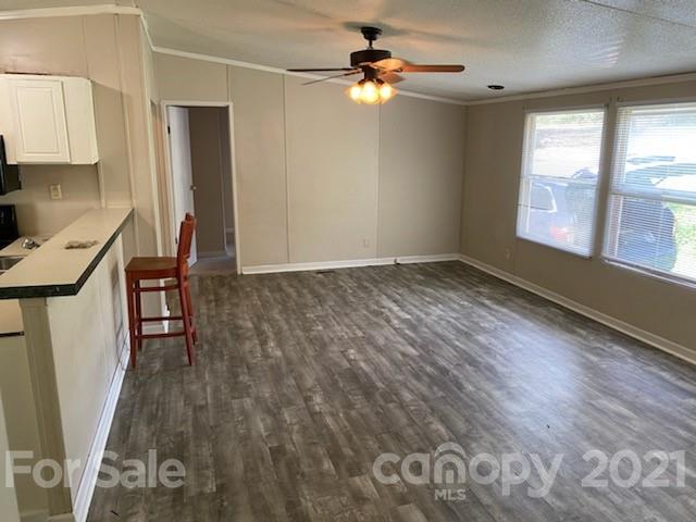 3310 Falcon Ridge Road Maiden, NC 28650 - Photo 4 of 12 wooden floor in an empty room with a window