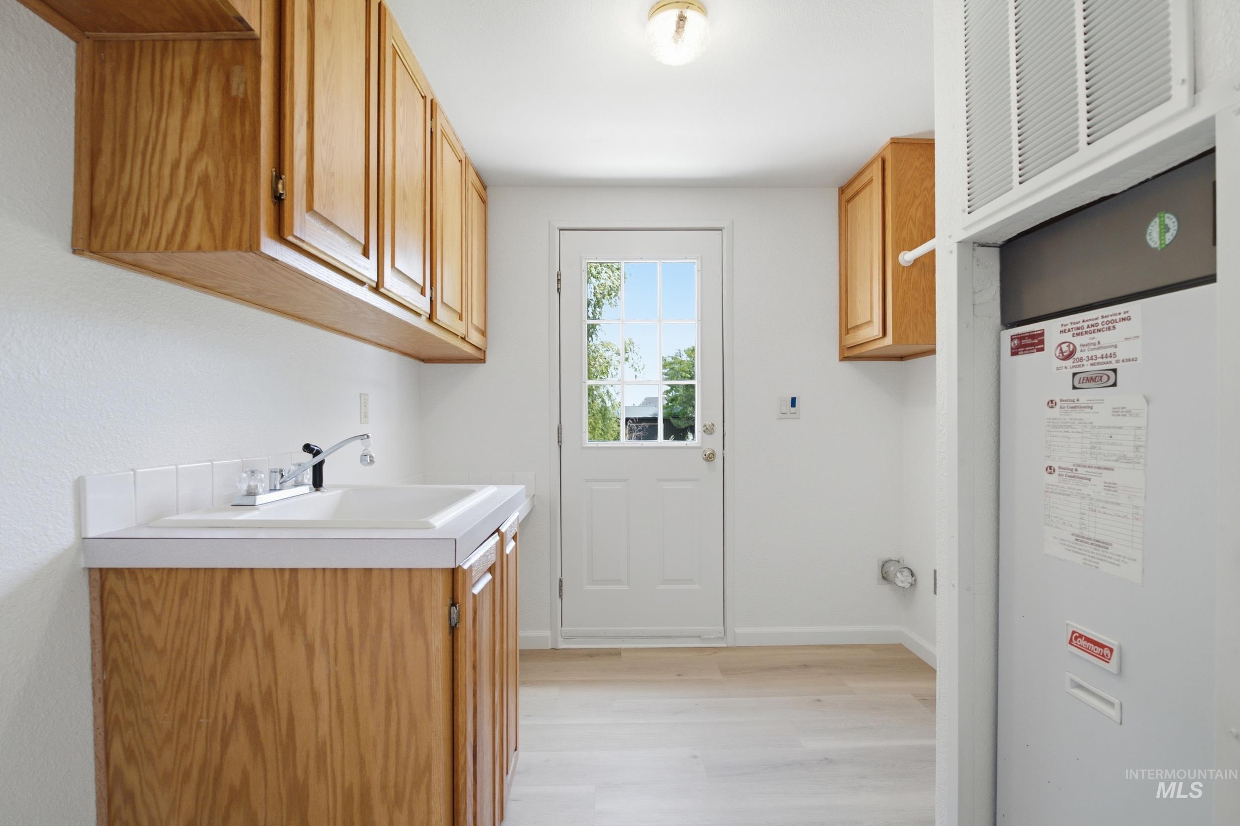 7422 Track Road Nampa, ID 83686 - Photo 17 of 50 Double French doors with wood-finish frames and clear glass panels