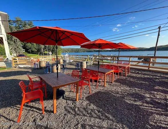 an outdoor space with patio tables and chairs