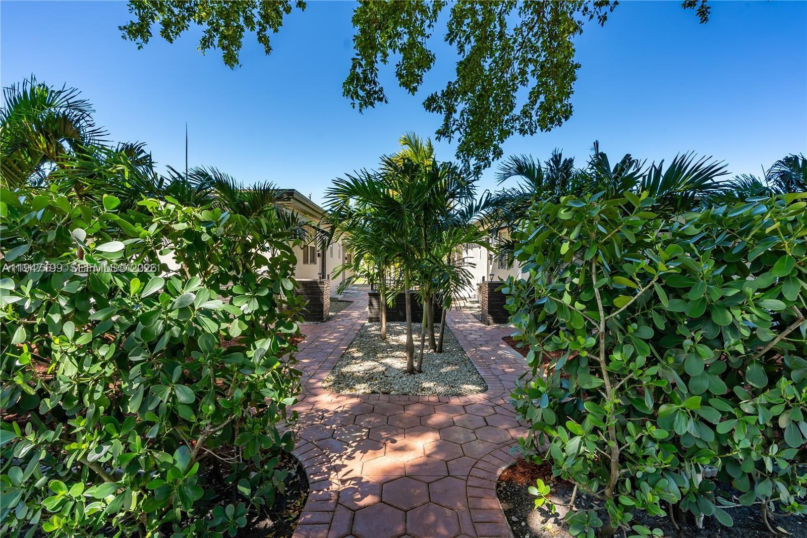 1925 Dewey Street, Unit 3 Hollywood, FL 33020 - Photo 2 of 27 a view of a yard with plants