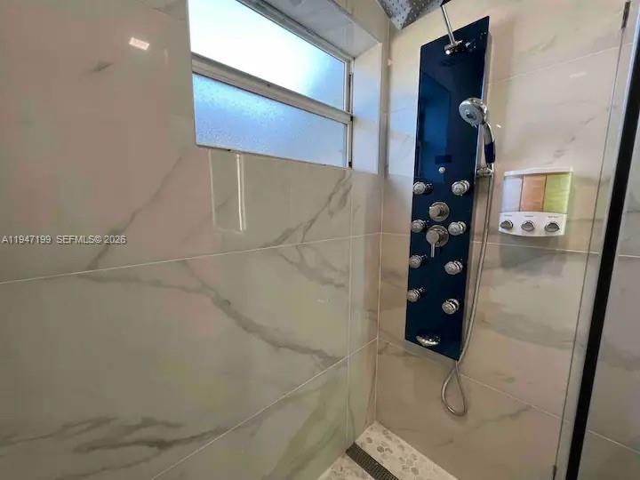 1925 Dewey Street, Unit 3 Hollywood, FL 33020 - Photo 22 of 27 a bathroom with a shower
