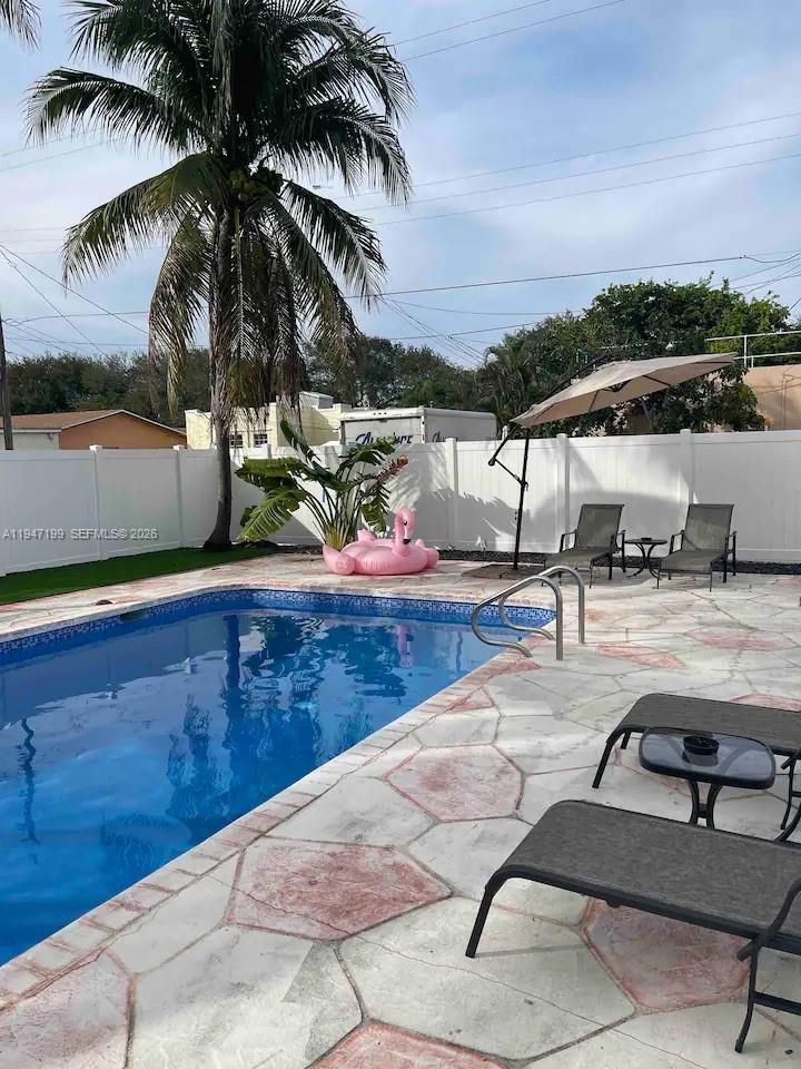 1925 Dewey Street, Unit 3 Hollywood, FL 33020 - Photo 25 of 27 a view of swimming pool with lounge chair