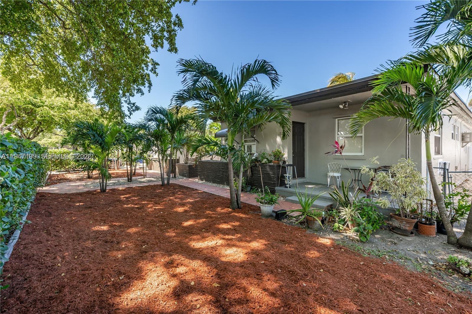 1925 Dewey Street, Unit 3 Hollywood, FL 33020 - Photo 27 of 27 a view of a house with a tree