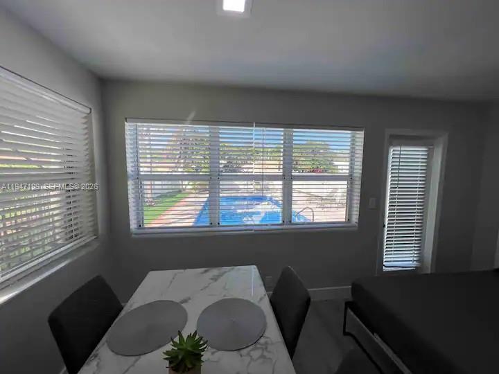 1925 Dewey Street, Unit 3 Hollywood, FL 33020 - Photo 8 of 27 a living room with furniture and a window