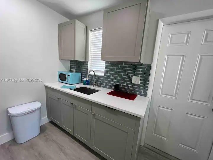 1925 Dewey Street, Unit 3 Hollywood, FL 33020 - Photo 10 of 27 a bathroom with a sink and a toilet