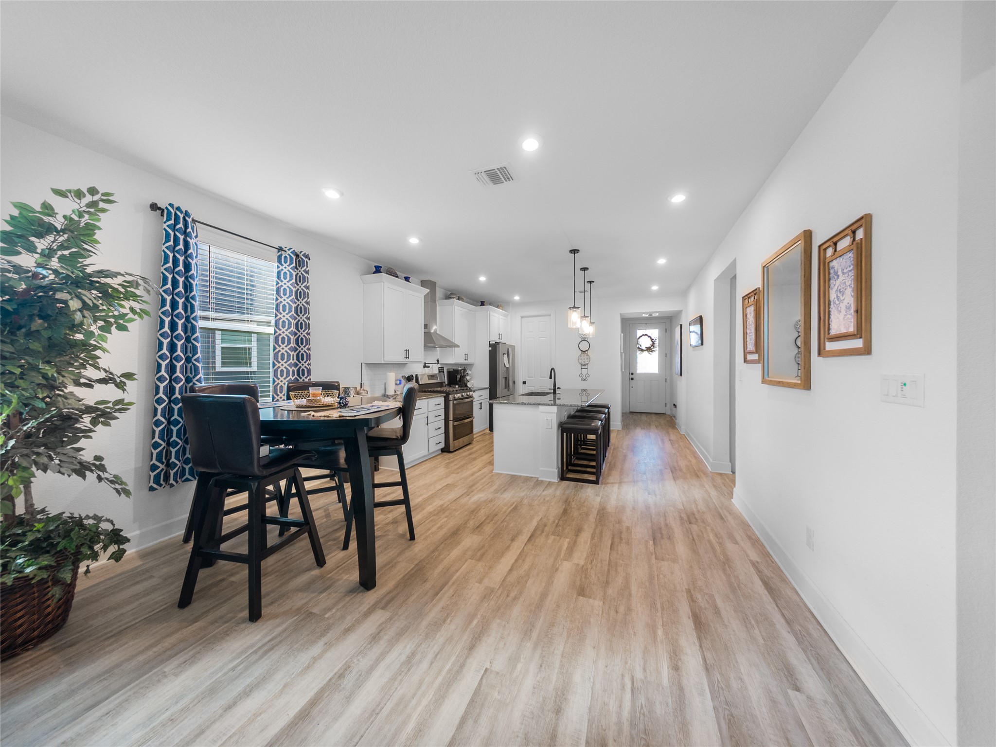 20811 Phebe Foster Street Manor, TX 78653 - Photo 11 of 40 Dining space with light wood-style floors and recessed lighting