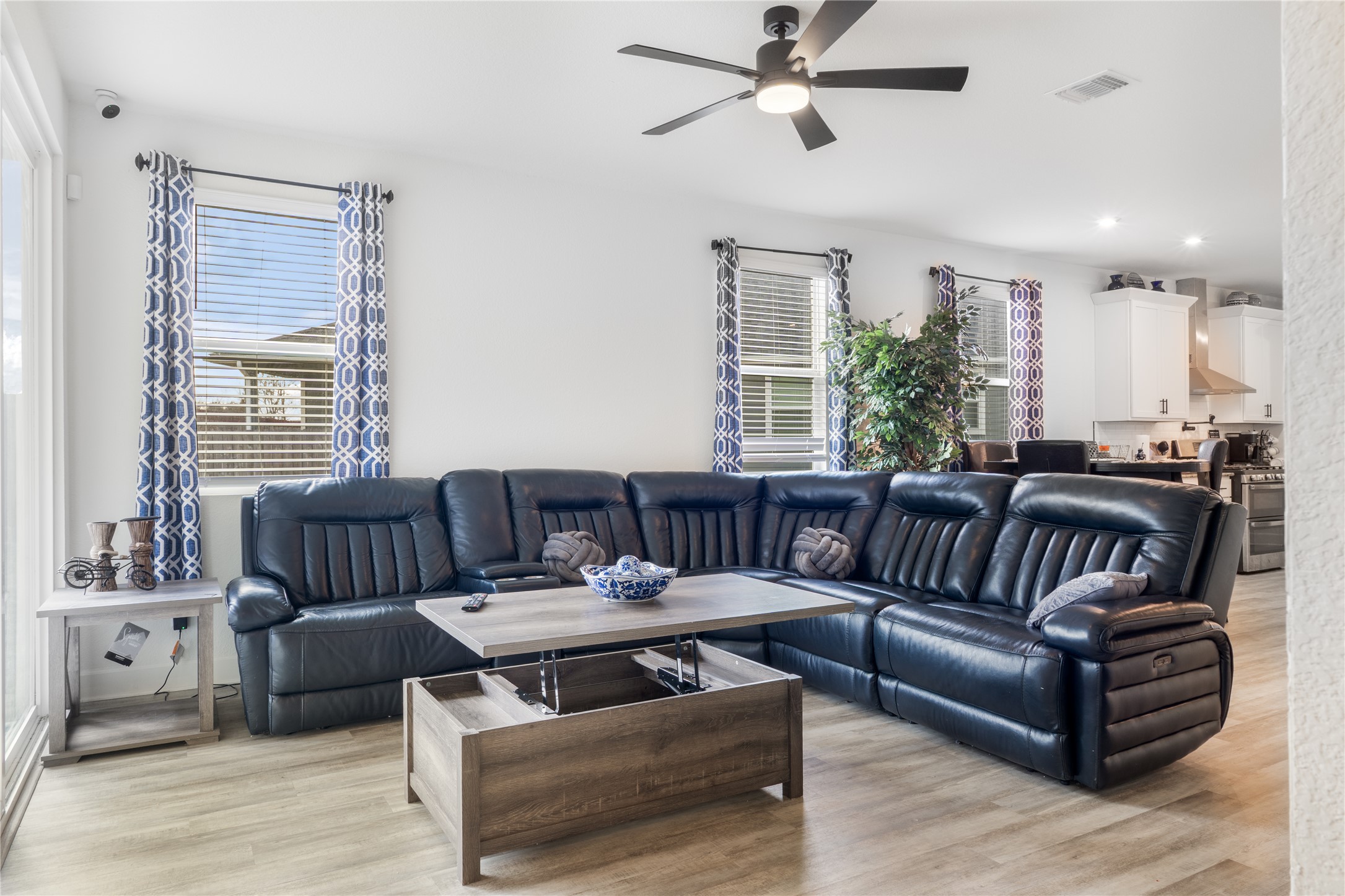 20811 Phebe Foster Street Manor, TX 78653 - Photo 13 of 40 Living room with light wood-style flooring, a ceiling fan, and recessed lighting