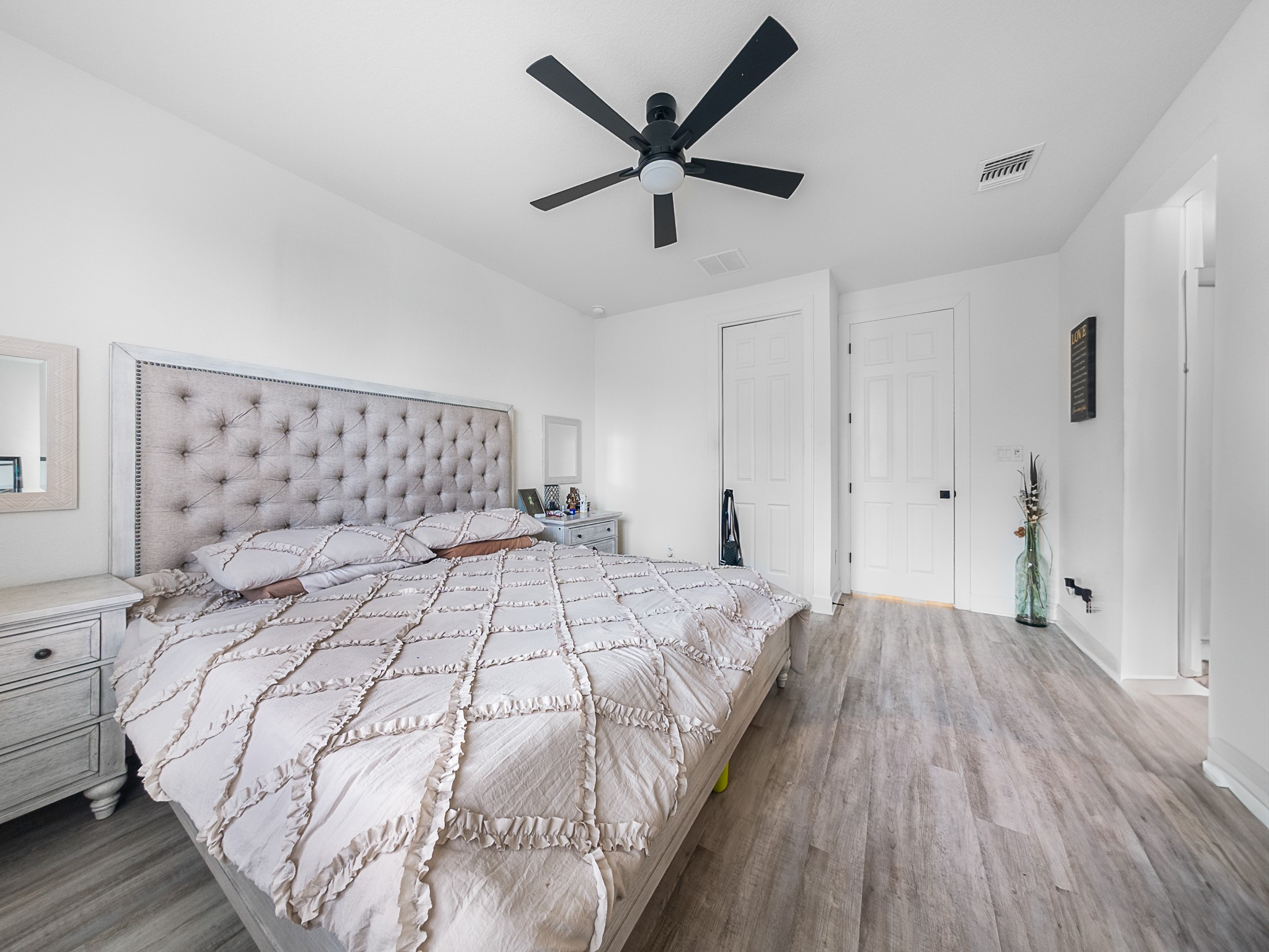 20811 Phebe Foster Street Manor, TX 78653 - Photo 18 of 40 Bedroom featuring dark wood-type flooring and ceiling fan