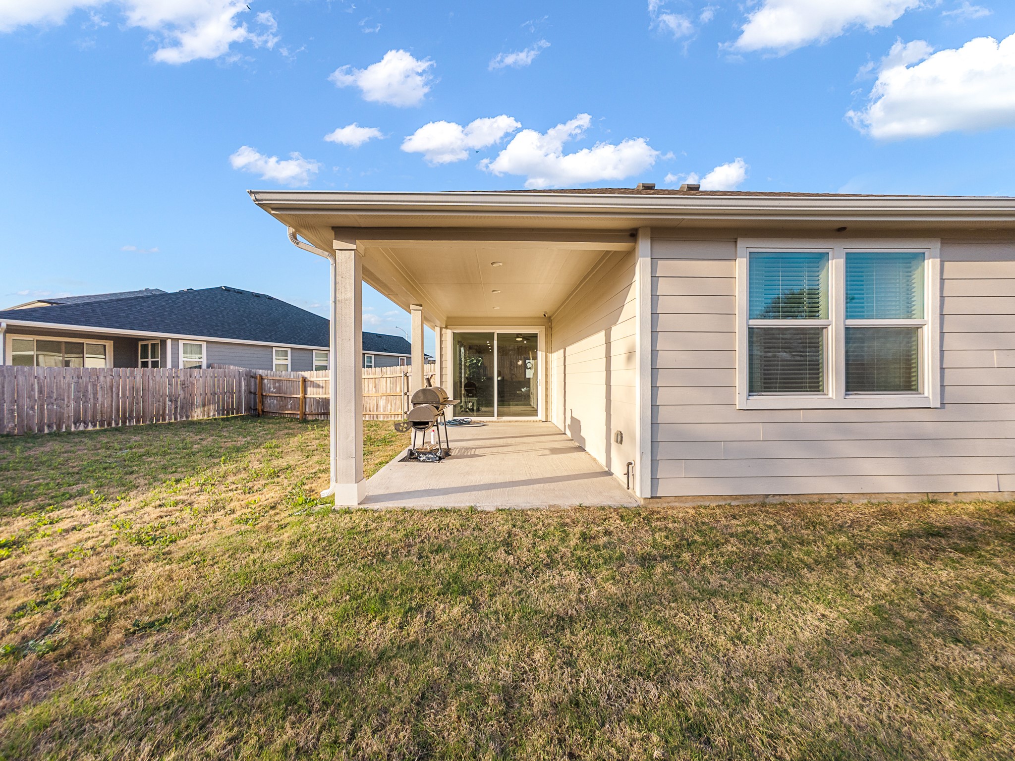 20811 Phebe Foster Street Manor, TX 78653 - Photo 30 of 40 Back of house featuring a patio area