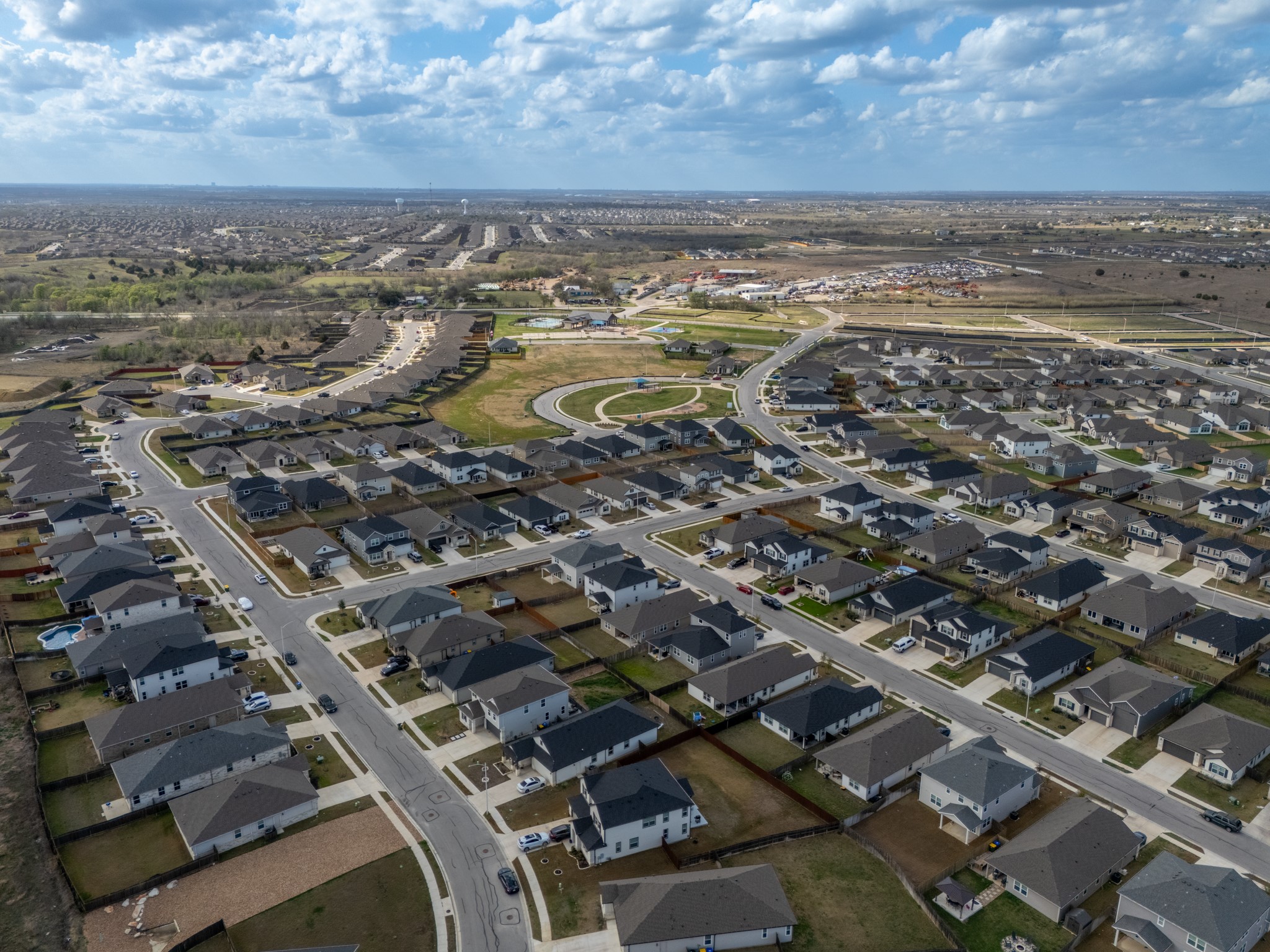 20811 Phebe Foster Street Manor, TX 78653 - Photo 34 of 40 Aerial view of property and surrounding area featuring nearby suburban area