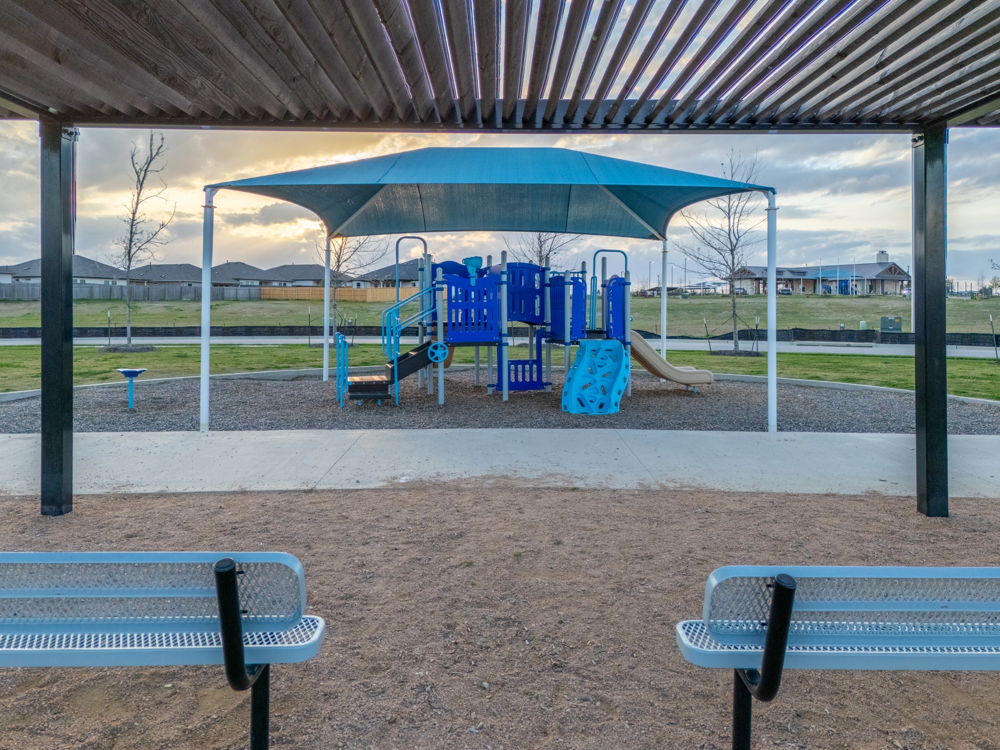 20811 Phebe Foster Street Manor, TX 78653 - Photo 36 of 40 Community play area with a residential view and a yard