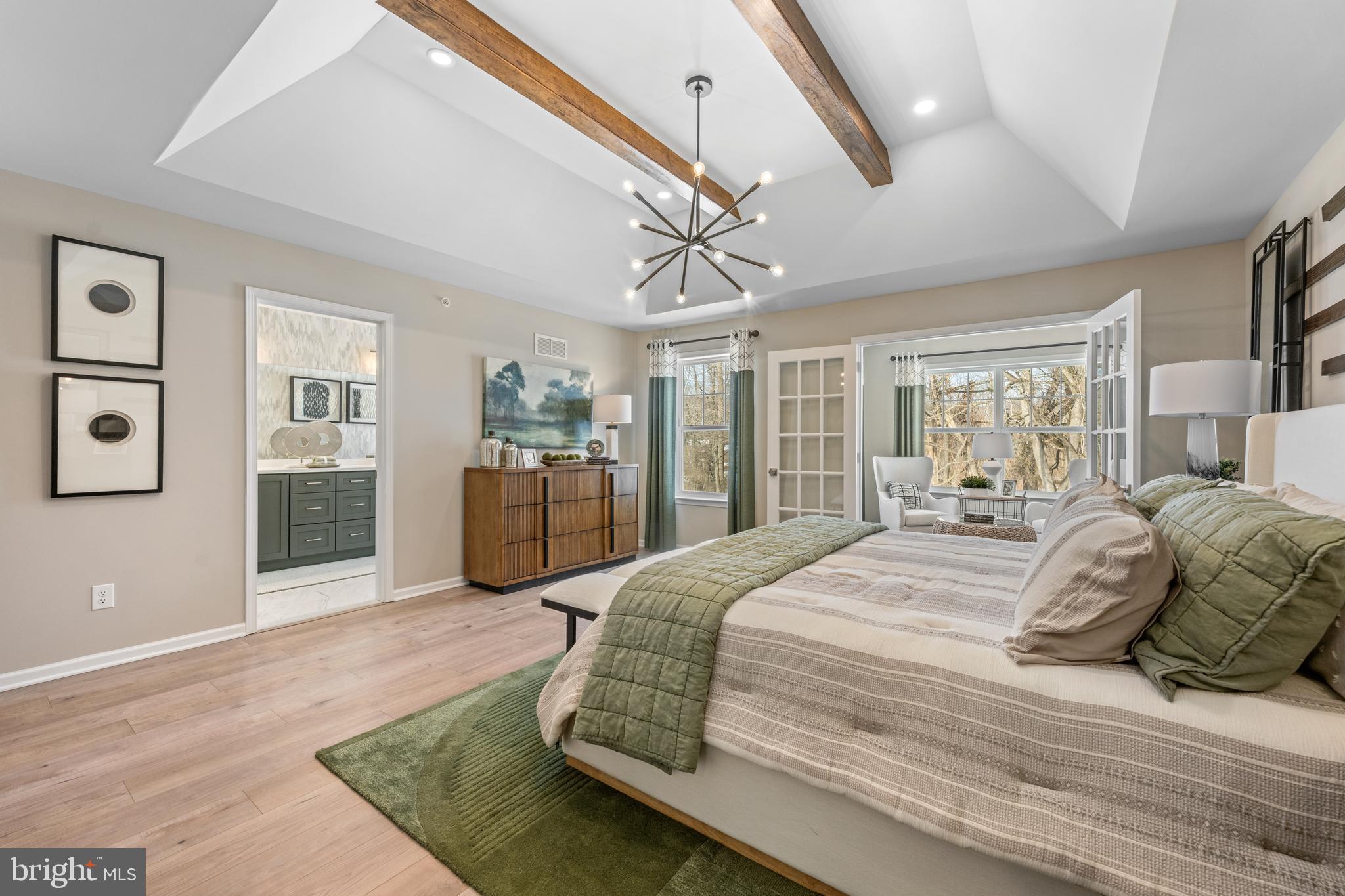 156 Bancroft Road, Unit SGR Kennett Square, PA 19348 - Photo 18 of 46 a spacious bedroom with a bed and ceiling fan