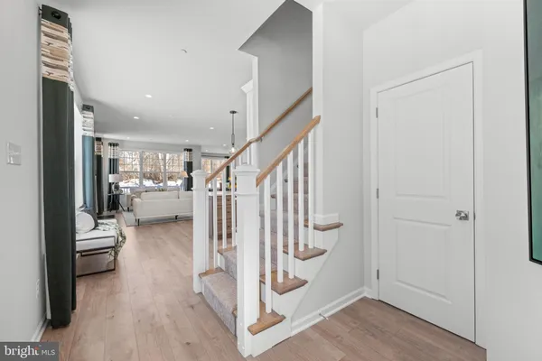 a view of entryway and livingroom with wooden floor