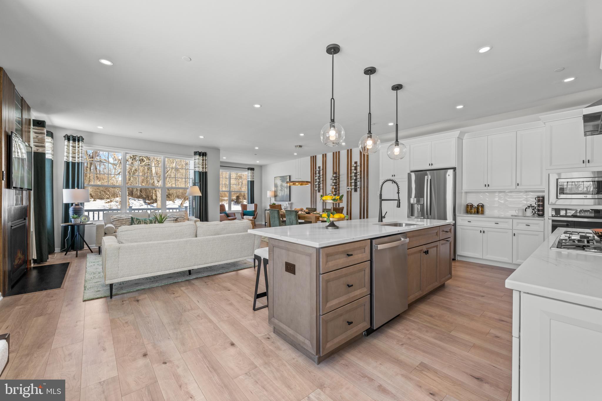 156 Bancroft Road, Unit SGR Kennett Square, PA 19348 - Photo 7 of 46 a large kitchen with stainless steel appliances lots of counter space sink and a wooden floor