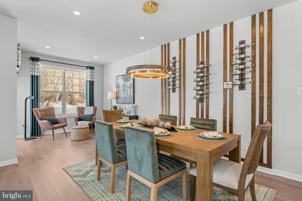 a view of a dining room with furniture and window
