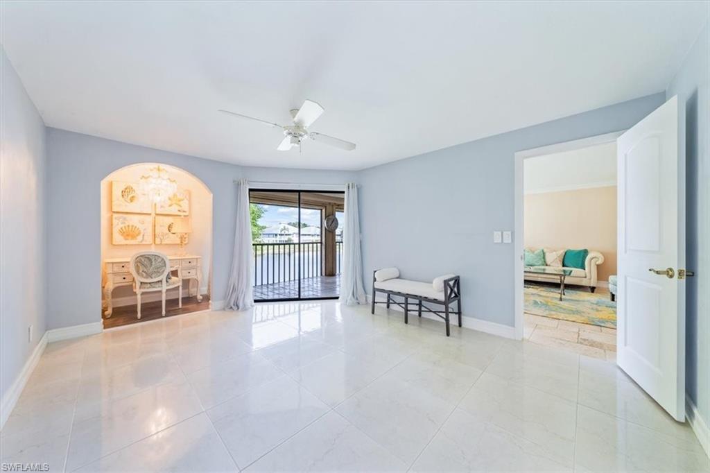 Undisclosed Address Naples, FL 34105 - Photo 18 of 24 a view of an empty room with furniture and a window