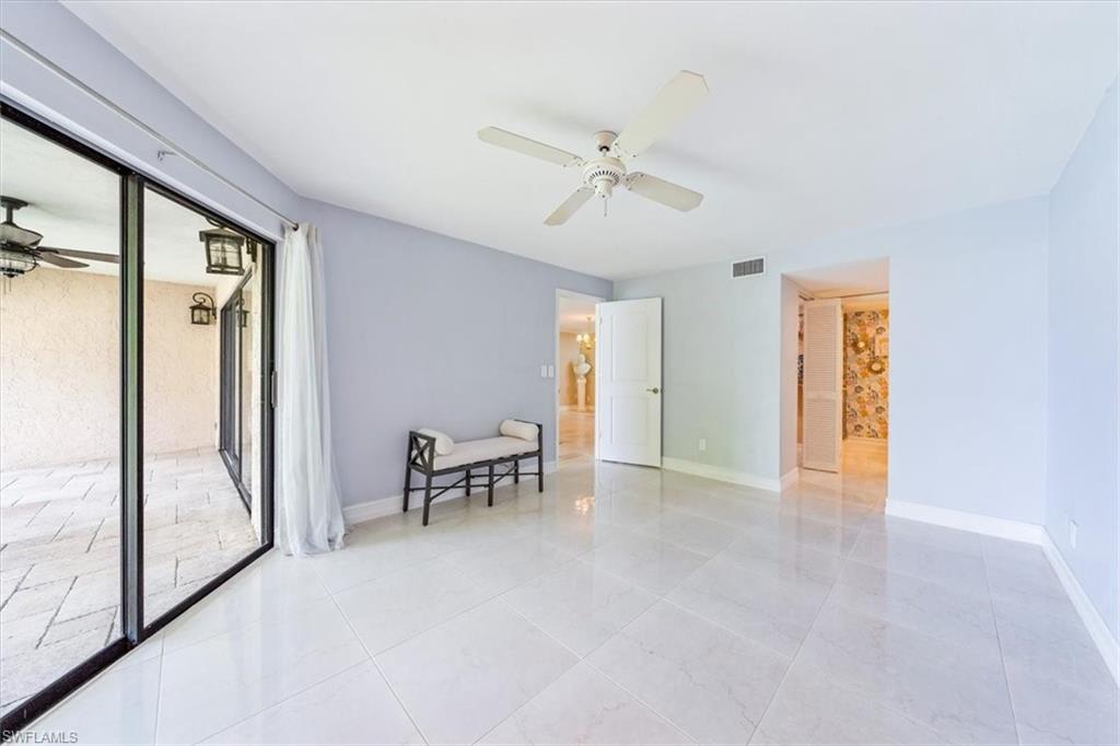 Undisclosed Address Naples, FL 34105 - Photo 19 of 24 a view of an empty room with a window