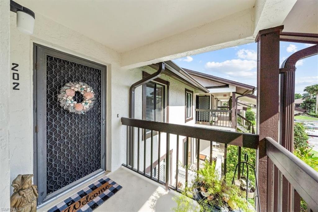Undisclosed Address Naples, FL 34105 - Photo 3 of 24 a view of a porch