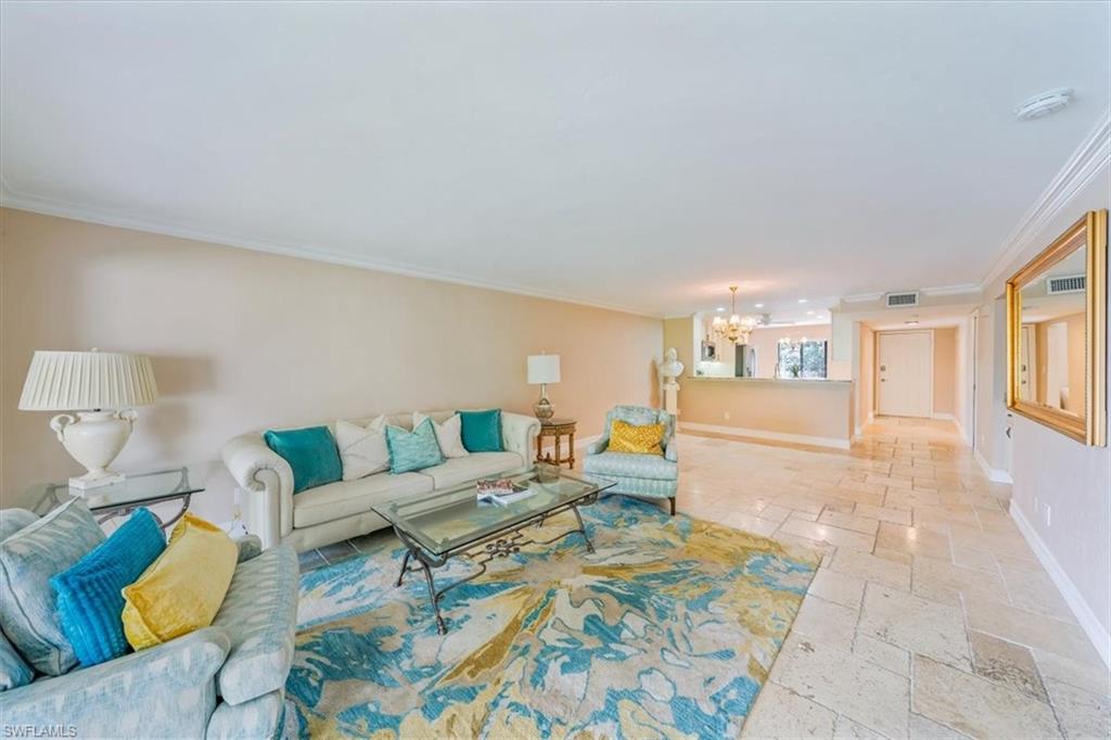 Undisclosed Address Naples, FL 34105 - Photo 4 of 24 a living room with furniture and a couch