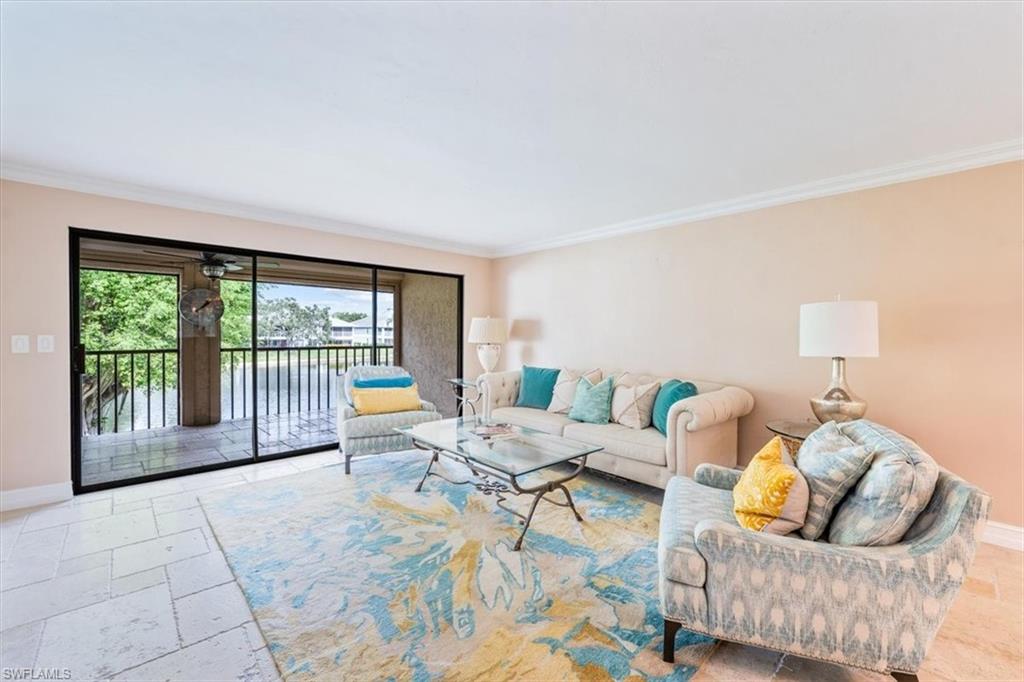 Undisclosed Address Naples, FL 34105 - Photo 5 of 24 a living room with furniture and a floor to ceiling window