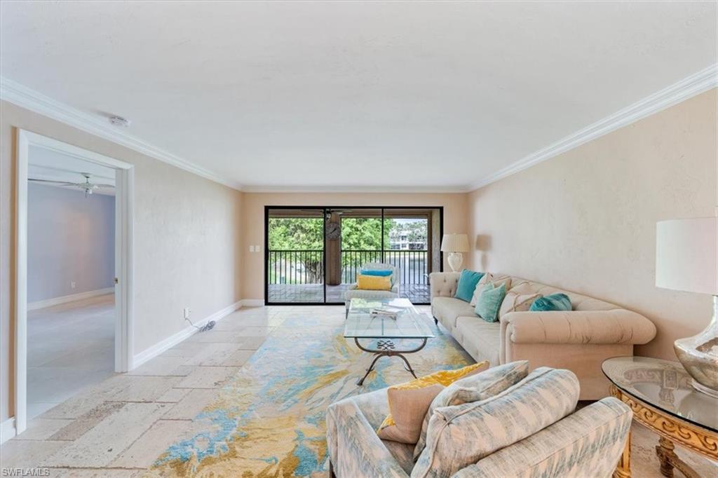 Undisclosed Address Naples, FL 34105 - Photo 6 of 24 a living room with furniture and a large window