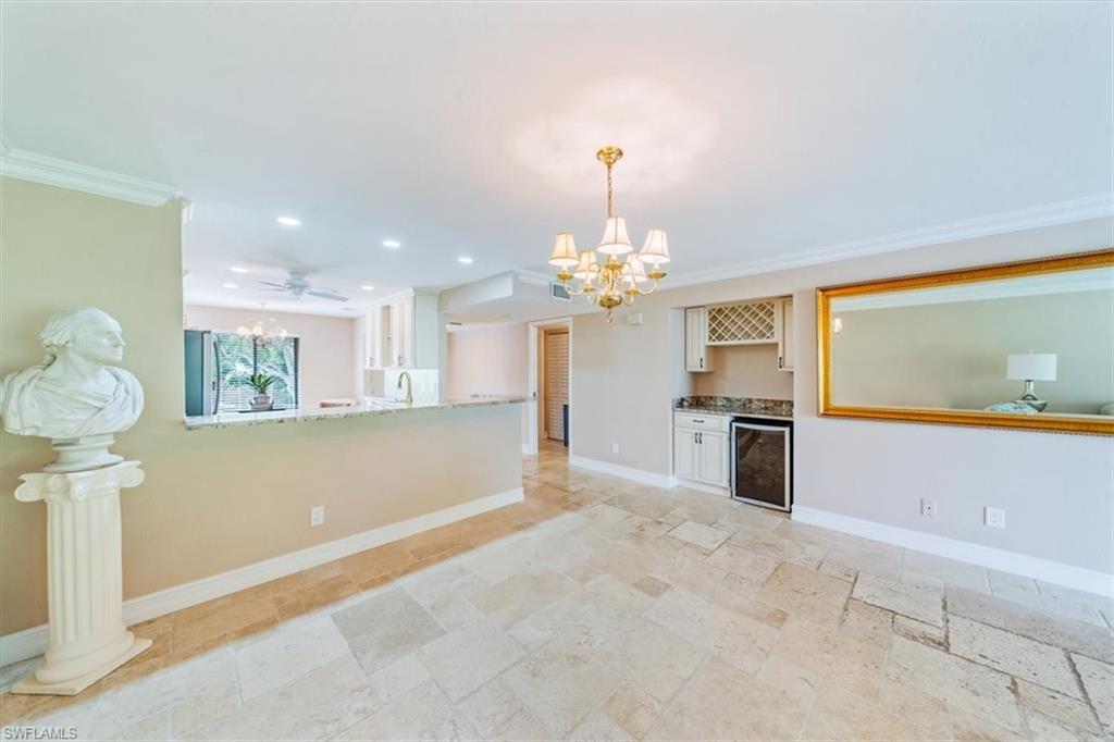 Undisclosed Address Naples, FL 34105 - Photo 9 of 24 a view of a kitchen with microwave and a sink