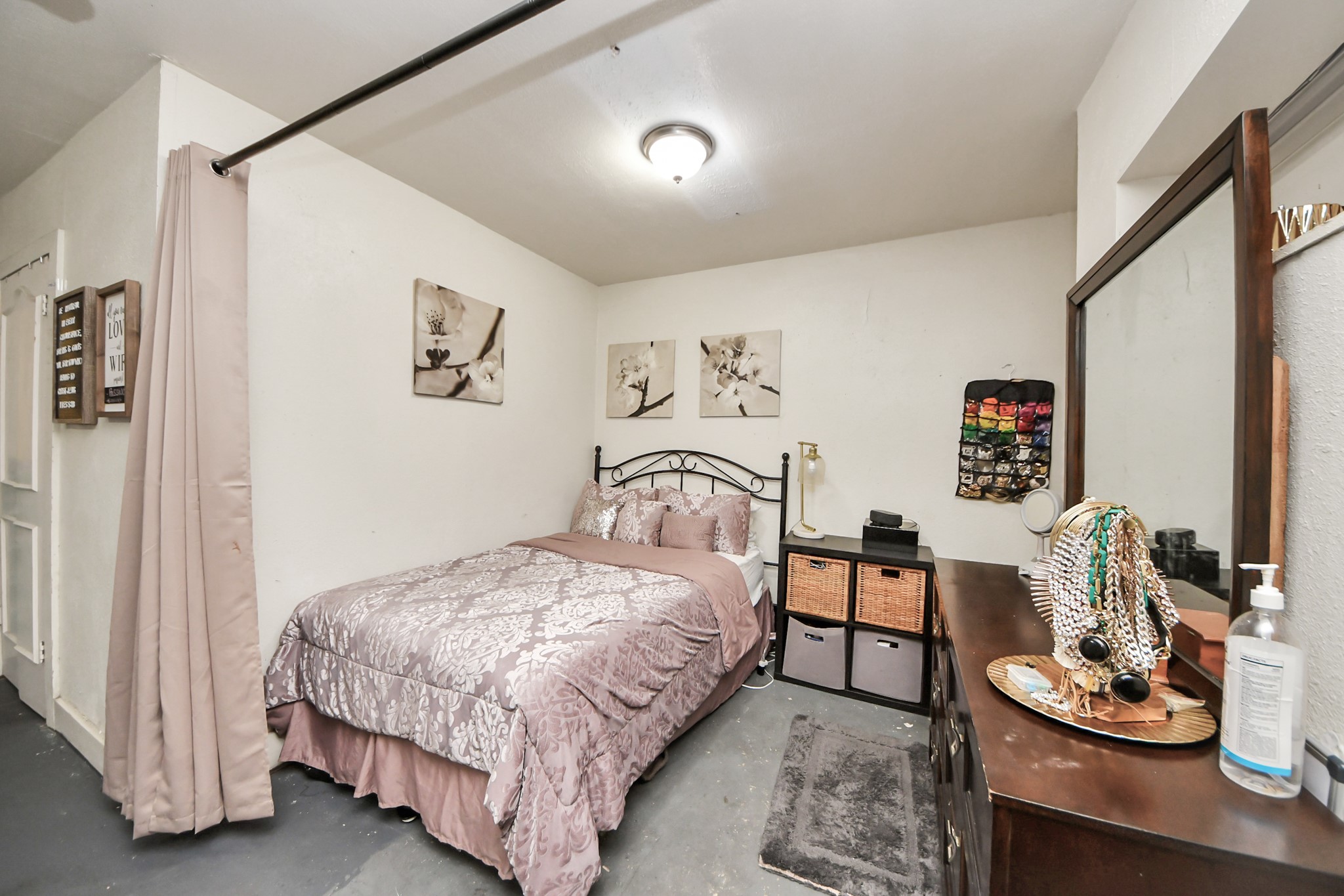 4155 Amir Street Houston, TX 77072 - Photo 29 of 43 a bedroom with a bed and a table in it