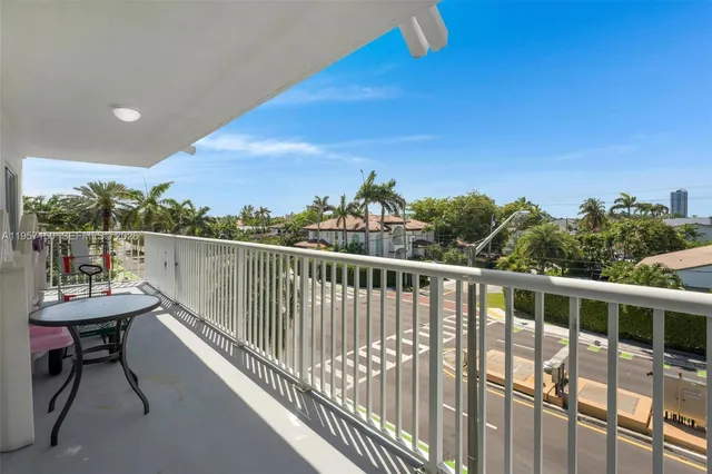 a view of a balcony with wooden floor and outdoor space