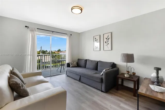 a living room with furniture and a window