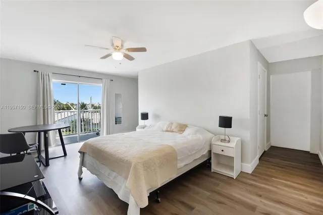 a bedroom with a bed and a table