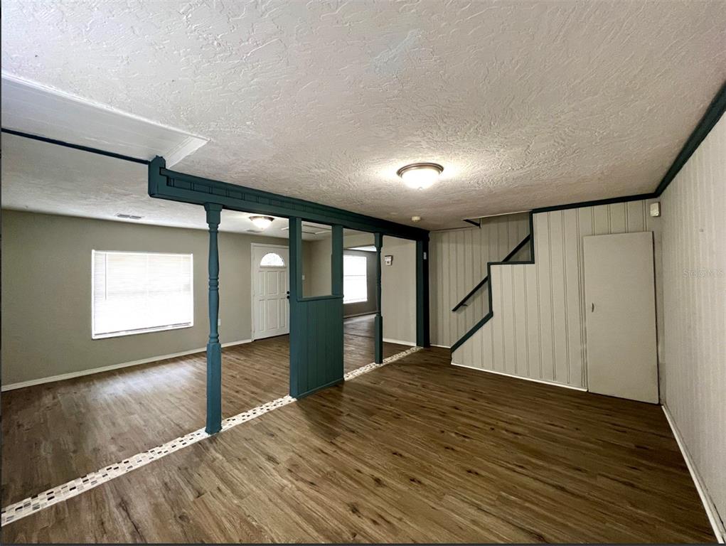 2003 10th Street South St. Petersburg, FL 33705 - Photo 13 of 16 a view of empty room with wooden floor and fan