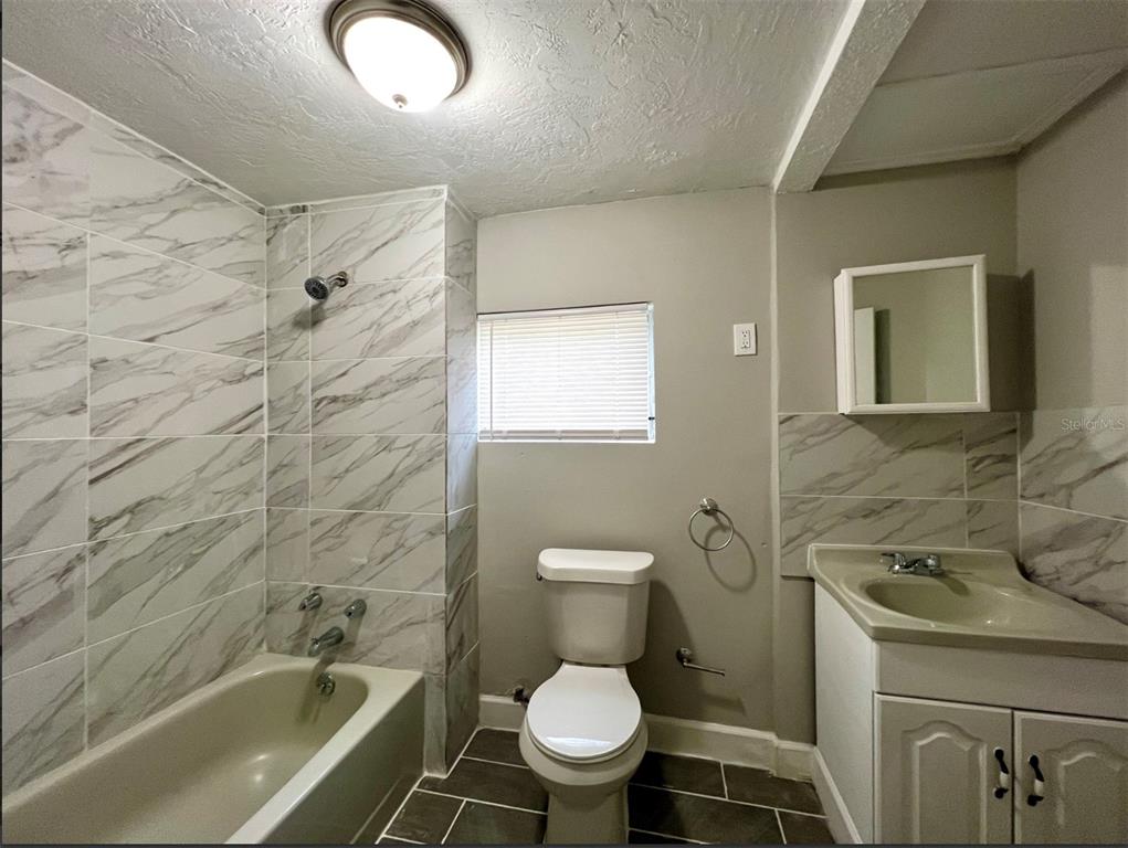 2003 10th Street South St. Petersburg, FL 33705 - Photo 4 of 16 a bathroom with a toilet and a sink