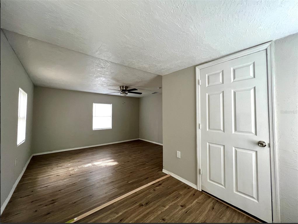 2003 10th Street South St. Petersburg, FL 33705 - Photo 5 of 16 wooden floor in an empty room with a window