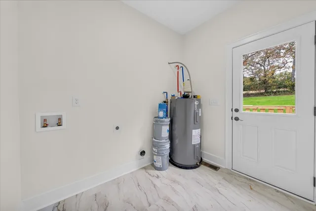 a bathroom with a bathtub shower sink vanity and toilet