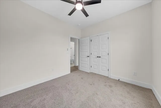 a front view of a house with a garden and deck