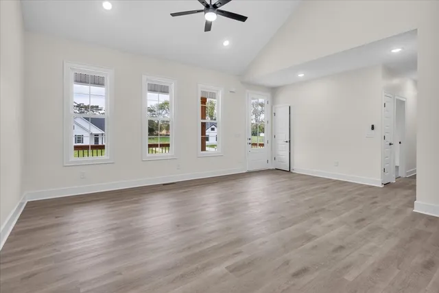 a kitchen with kitchen island white cabinets and stainless steel appliances
